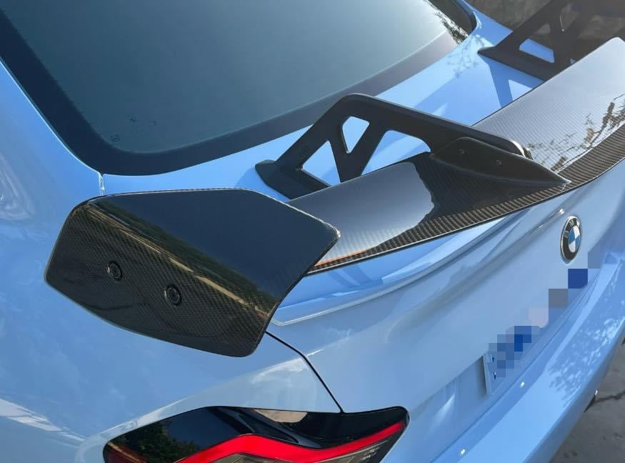 https://www.thecarbonindustries.com › products › ad-style-carbon-fiber-swan-neck-wing-bmw-g87-m2