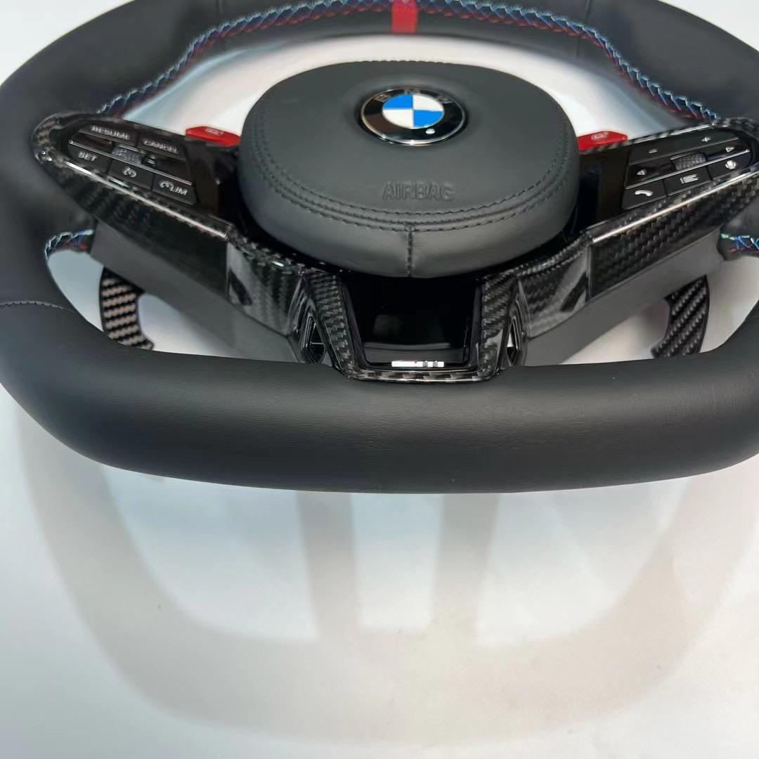 https://www.thecarbonindustries.com › products › 2025-lci-steering-wheel-w-carbon-fiber-trim-bmw-g-chassis