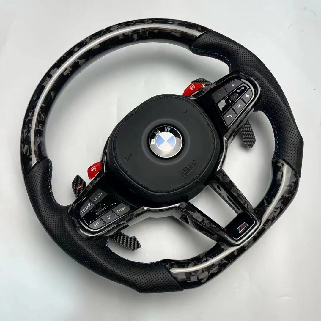 https://www.thecarbonindustries.com › products › 2025-lci-steering-wheel-w-carbon-fiber-trim-bmw-g-chassis