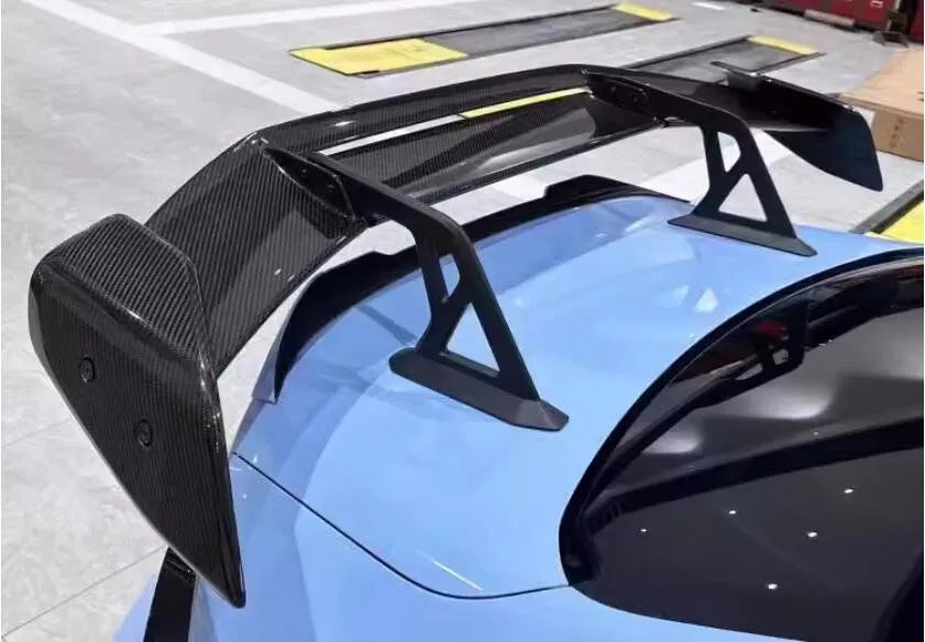 https://www.thecarbonindustries.com › products › ad-style-carbon-fiber-swan-neck-wing-bmw-g87-m2

